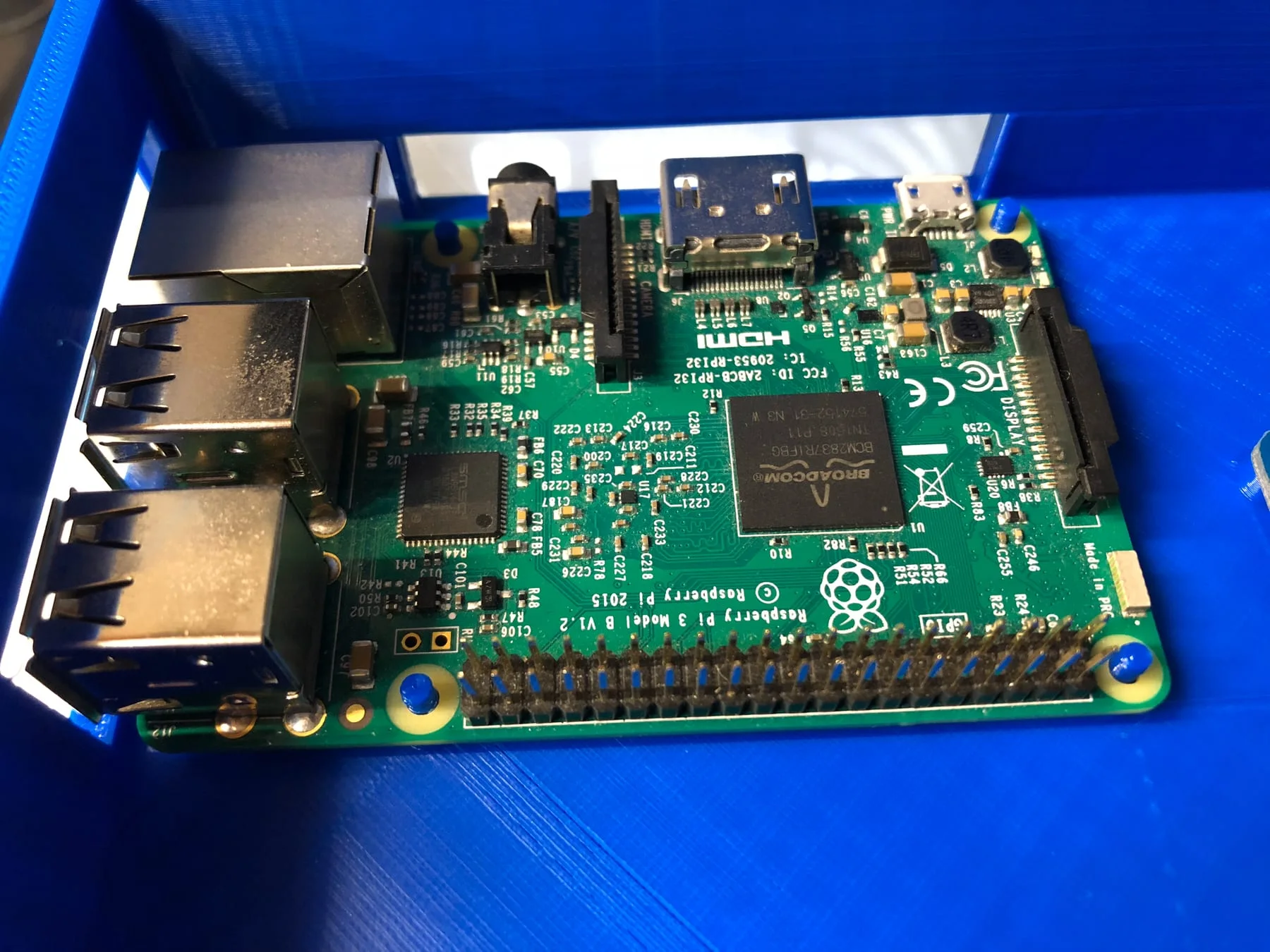 Single-board computer fitted into a blue printed controller enclosure