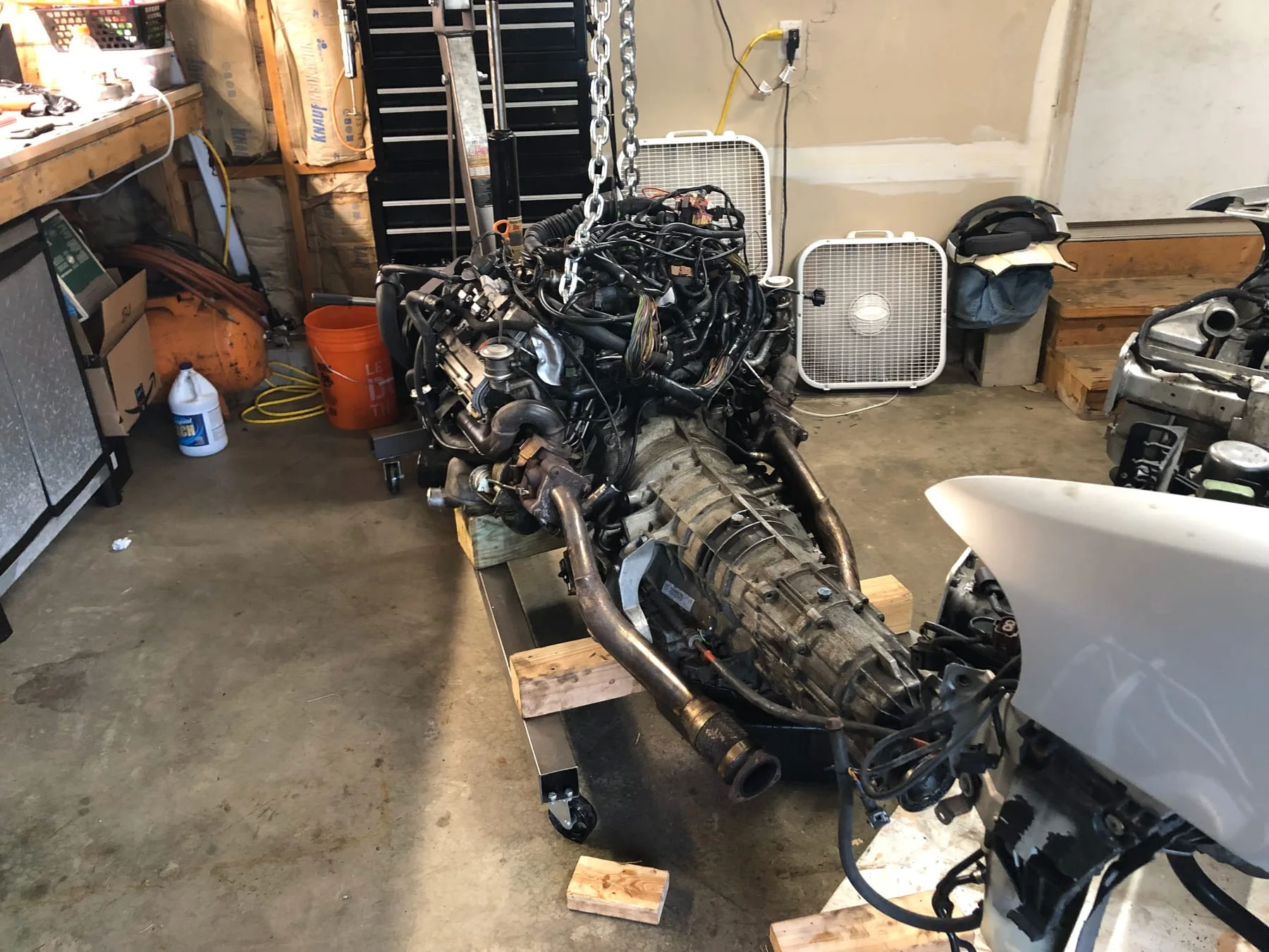 B5 S4 engine and transmission being removed in the workshop