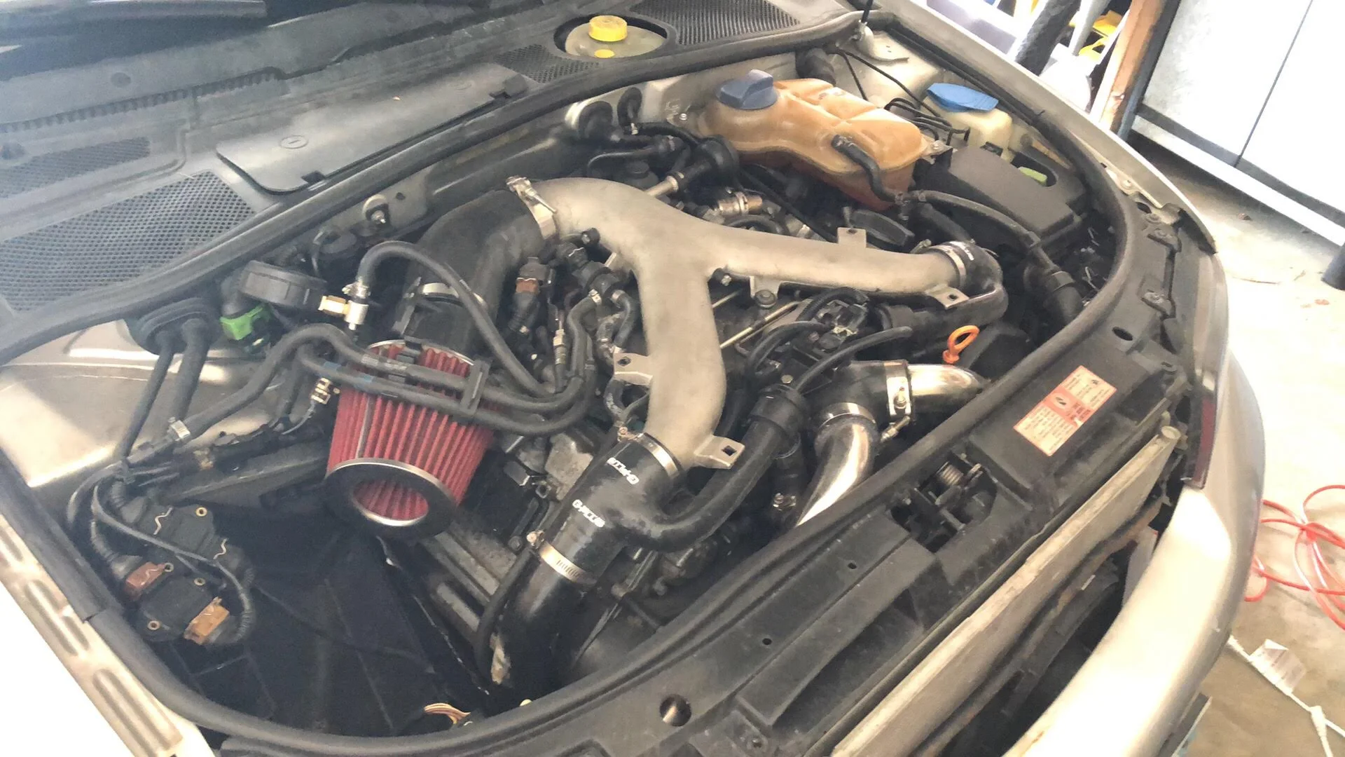 Completed B5 S4 engine bay with upgraded intake and plumbing